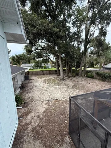a swimming pool with yard view