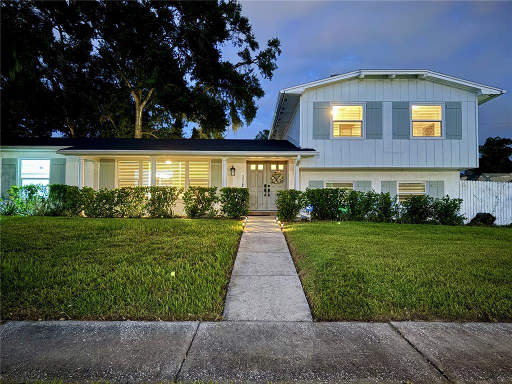 502 Oakhurst Street Brandon, FL 33511 - Photo 4 of 40 a front view of a house with a yard