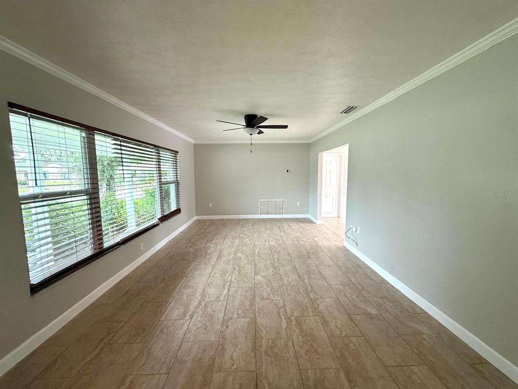 502 Oakhurst Street Brandon, FL 33511 - Photo 8 of 40 wooden floor in an empty room with a window