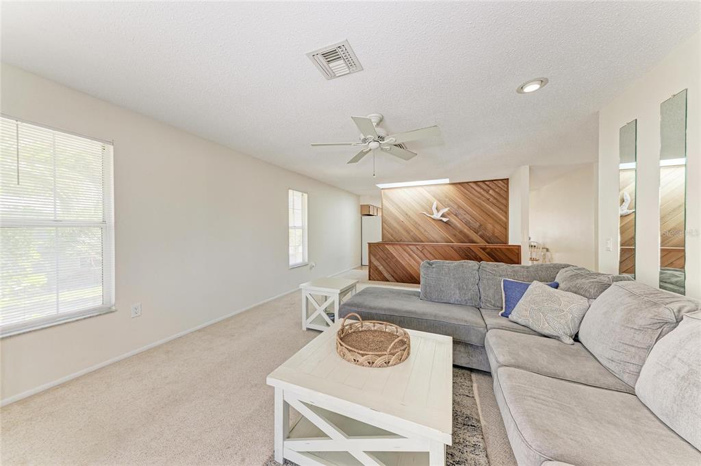 517 Spring Avenue Anna Maria, FL 34216 - Photo 12 of 50 a living room with furniture and a window