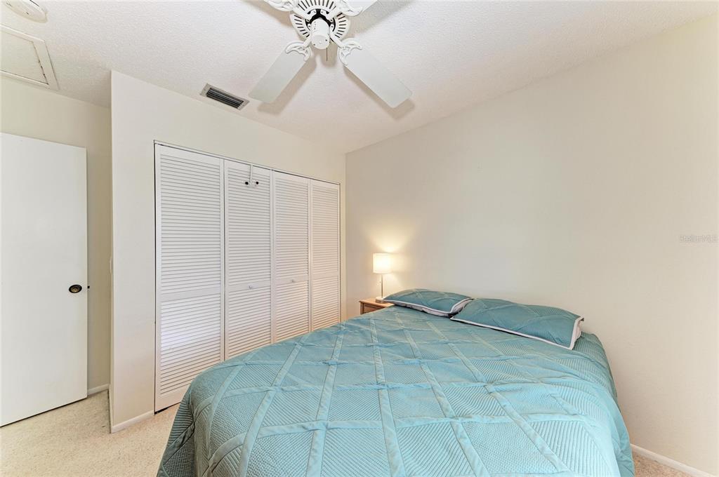 517 Spring Avenue Anna Maria, FL 34216 - Photo 25 of 50 a bedroom with a bed and closet