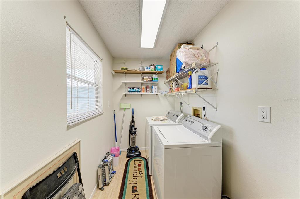517 Spring Avenue Anna Maria, FL 34216 - Photo 28 of 50 a utility room with dryer and washer
