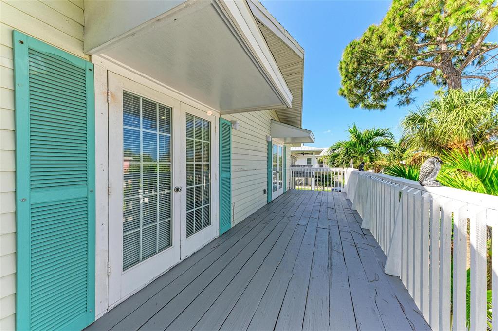 517 Spring Avenue Anna Maria, FL 34216 - Photo 29 of 50 a view of a house with a deck