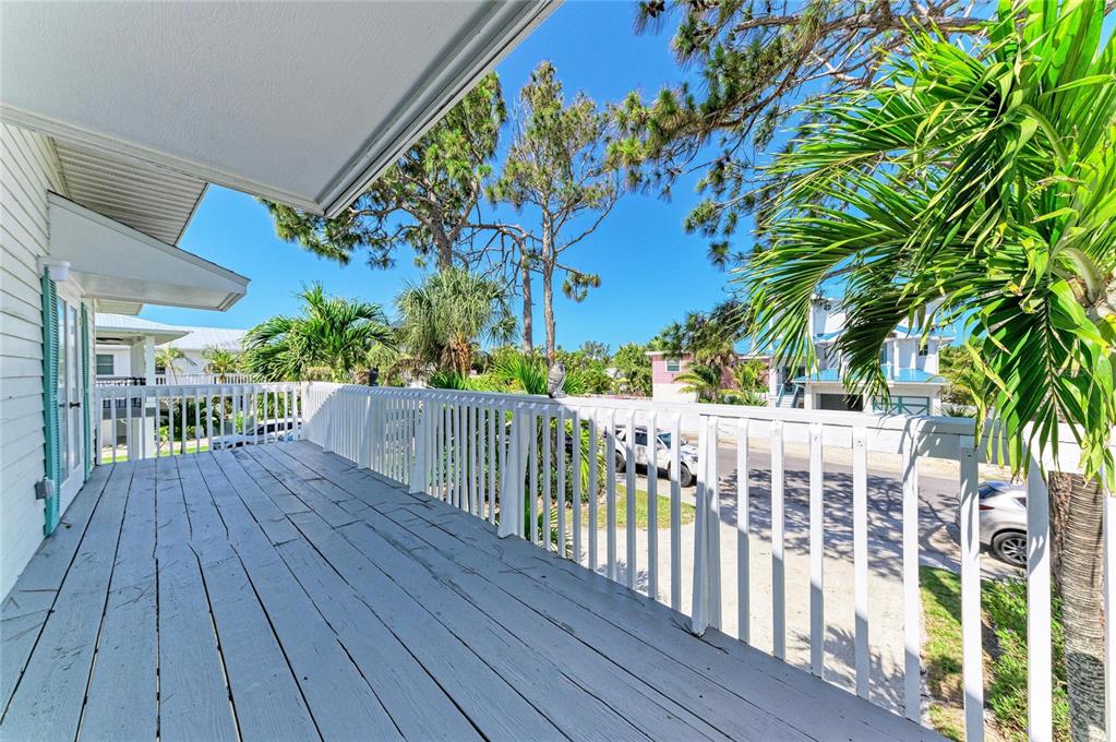 517 Spring Avenue Anna Maria, FL 34216 - Photo 30 of 50 a view of deck with wooden floor and fence