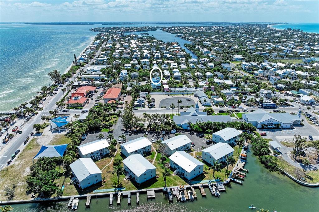 517 Spring Avenue Anna Maria, FL 34216 - Photo 4 of 50 an aerial view of a house with a garden
