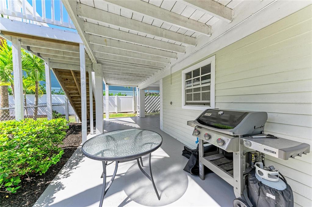 517 Spring Avenue Anna Maria, FL 34216 - Photo 41 of 50 a backyard of a house with outdoor seating