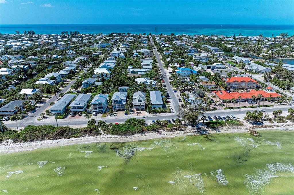 517 Spring Avenue Anna Maria, FL 34216 - Photo 49 of 50 a view of a city with lots of residential buildings ocean and mountain view in back