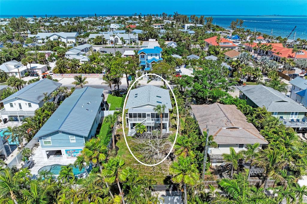 517 Spring Avenue Anna Maria, FL 34216 - Photo 5 of 50 an aerial view of multiple houses with yard