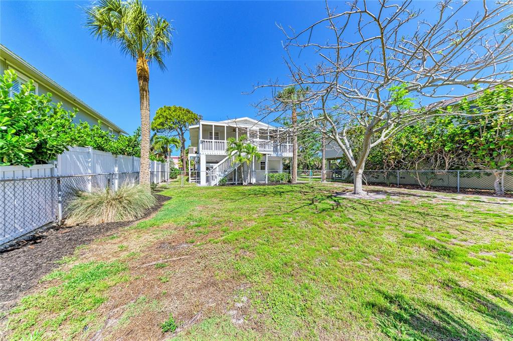 517 Spring Avenue Anna Maria, FL 34216 - Photo 6 of 50 a view of a yard with a house