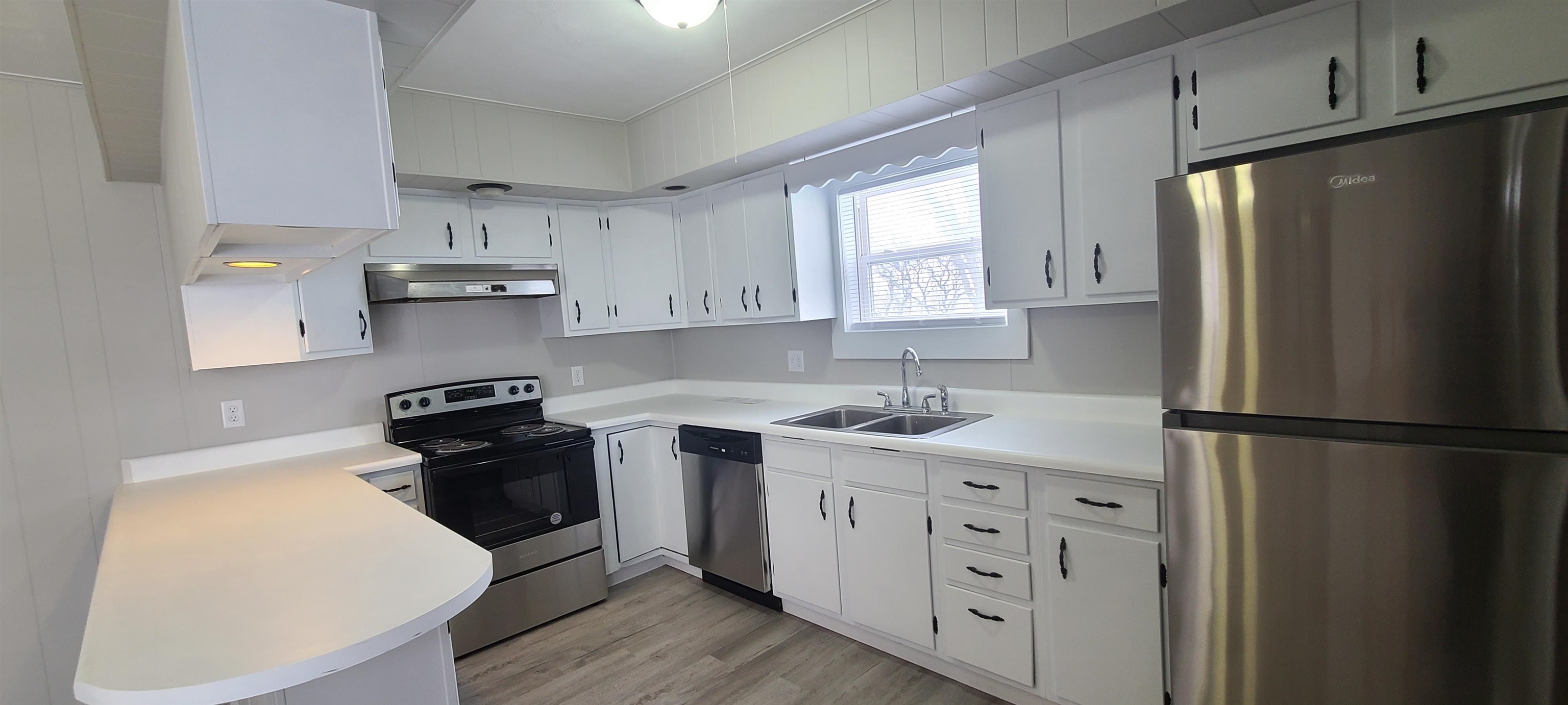 3330 South Watertown Road Oregon, IL 61061 - Photo 4 of 20 a kitchen with stainless steel appliances a refrigerator stove and sink