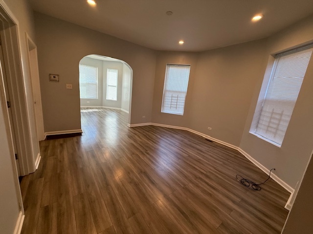 7336 South Emerald Avenue Chicago, IL 60621 - Photo 4 of 11 wooden floor in an empty room with a window