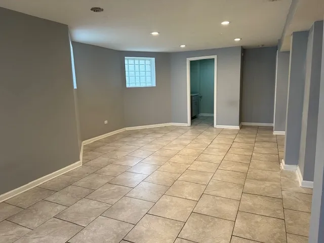 a view of an empty room and window