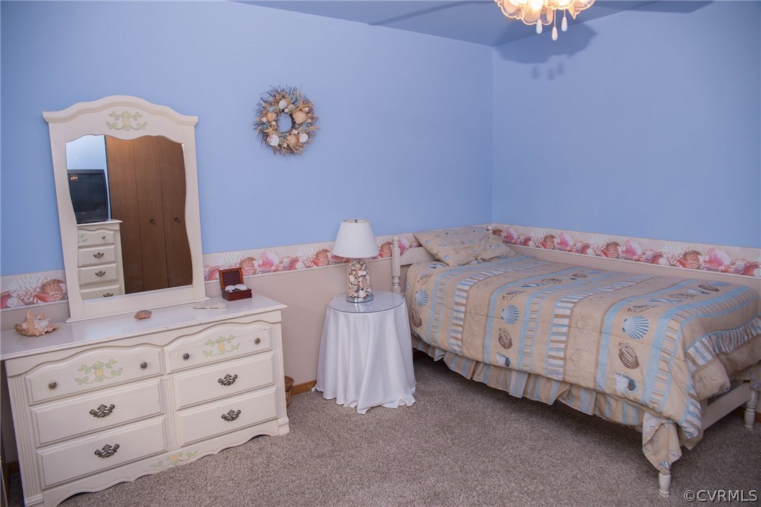 3206 Roland View Terrace Chester, VA 23831 - Photo 17 of 29 a bedroom with a bed and a dresser