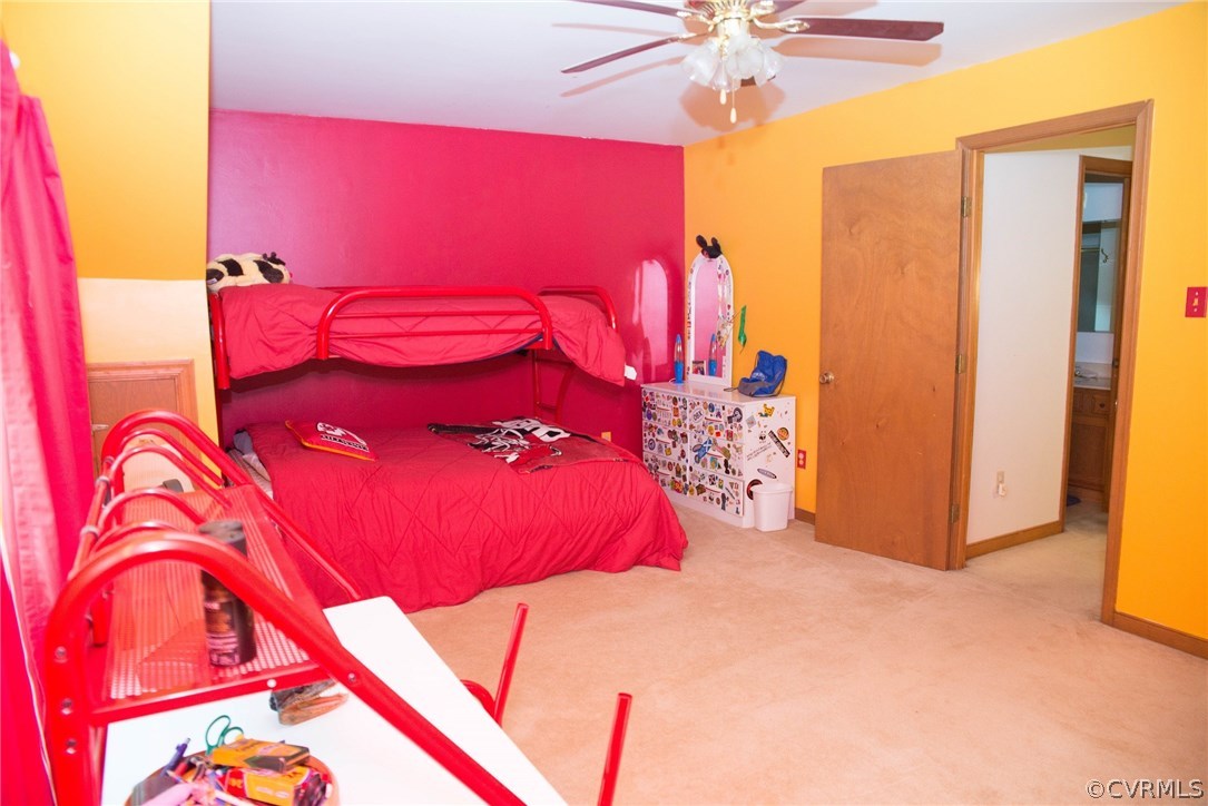3206 Roland View Terrace Chester, VA 23831 - Photo 25 of 29 a bedroom with a bed and a chandelier