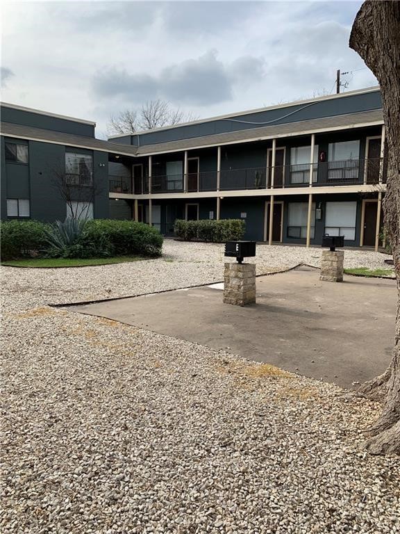 a chair and table in front of house