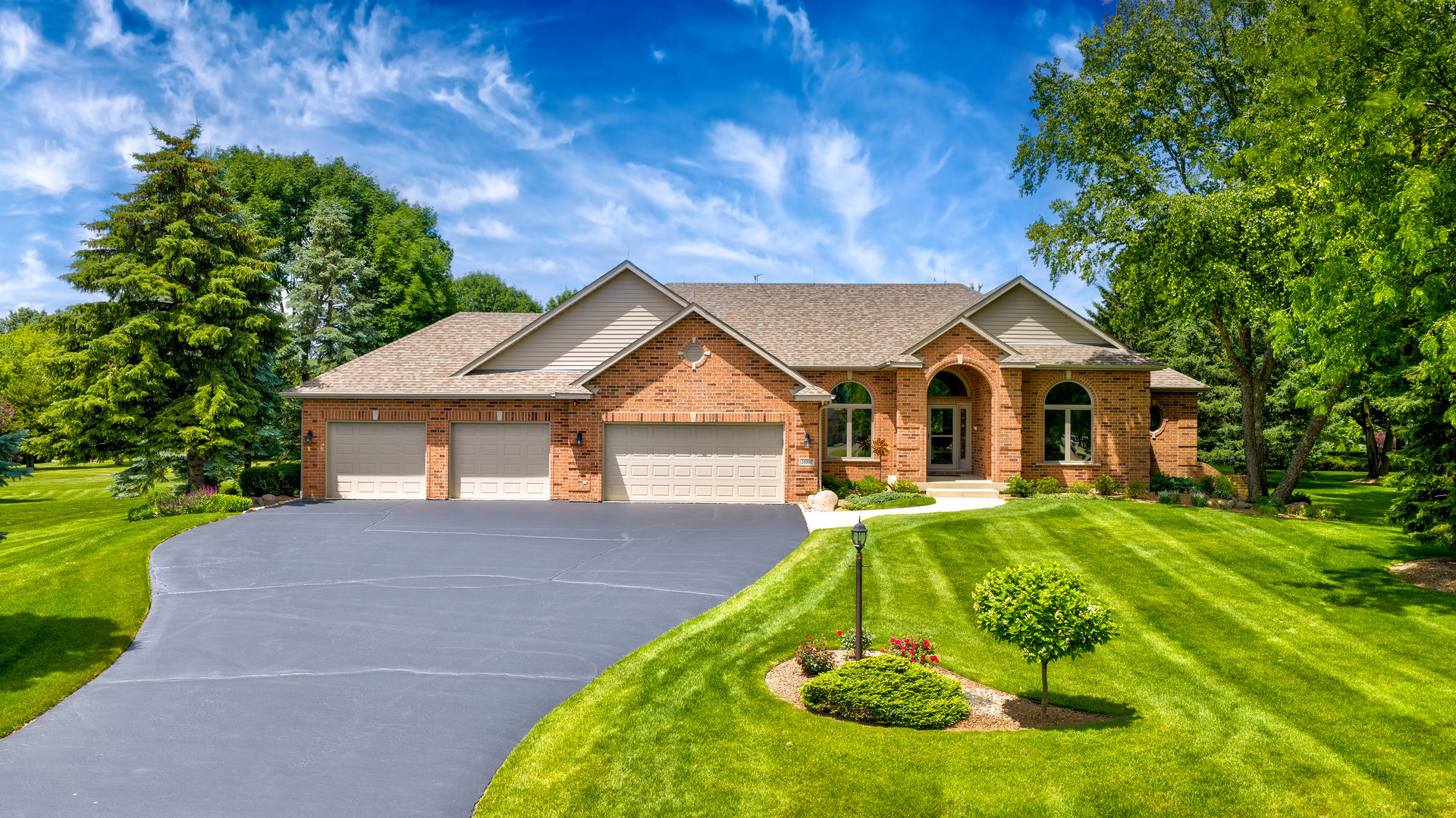 10907 Red Hawk Lane Spring Grove, IL 60071 - Photo 2 of 44 a front view of a house with yard