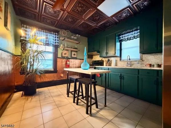 a room with granite countertop lots of counter top space and a sink