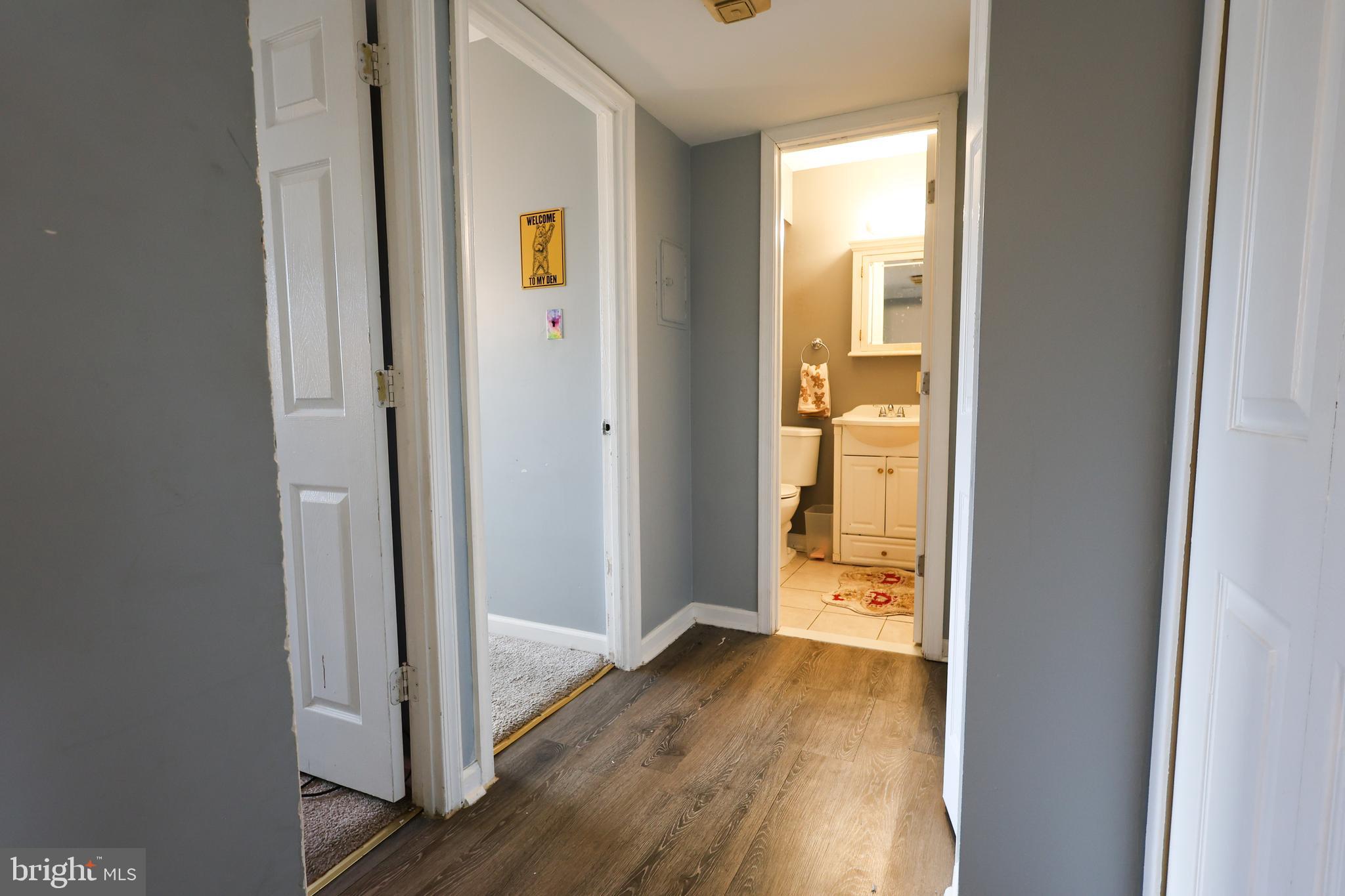 7232 Donnell Place, Unit D District Heights, MD 20747 - Photo 16 of 23 a view of a hallway with wooden floor