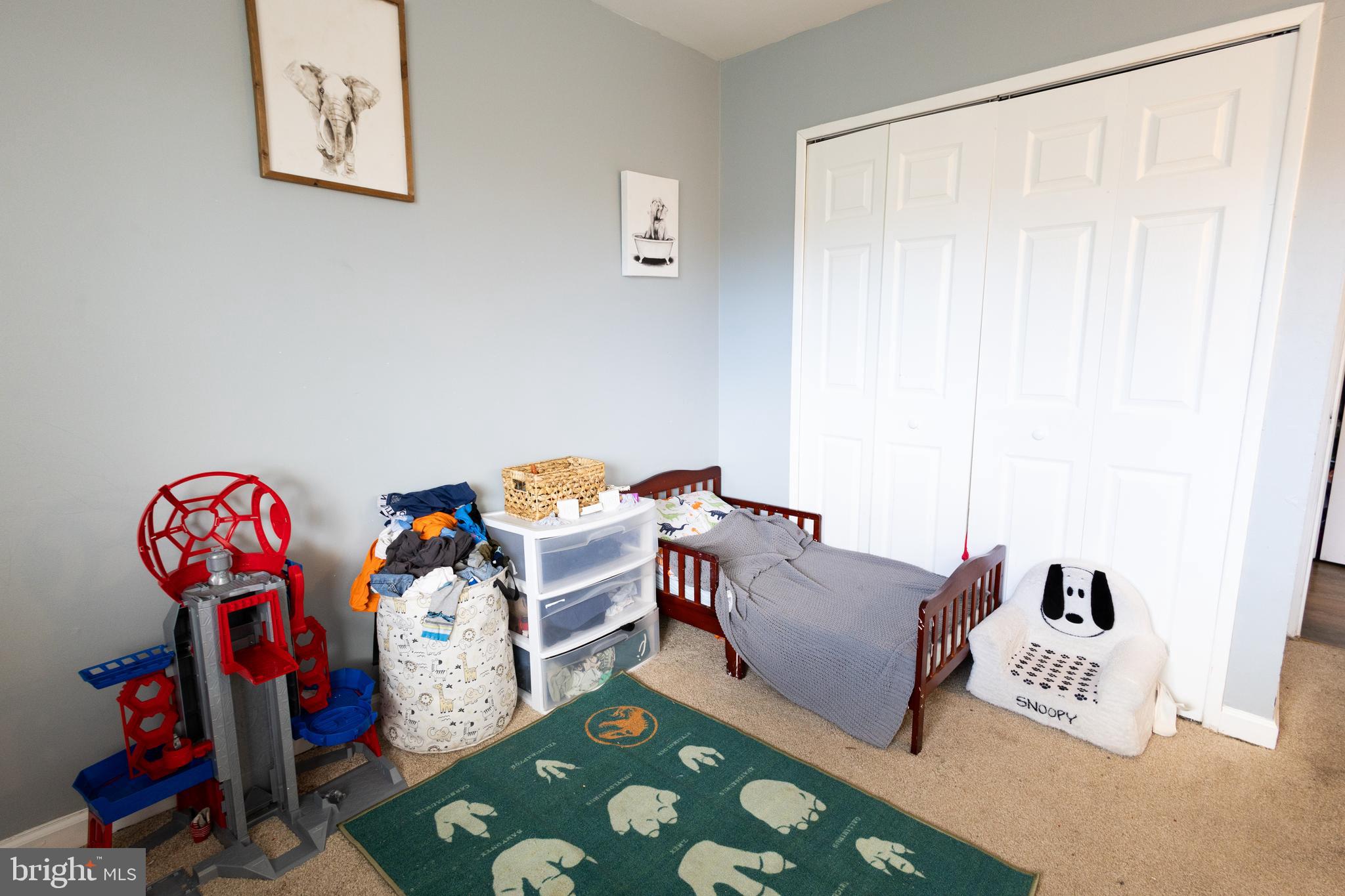 7232 Donnell Place, Unit D District Heights, MD 20747 - Photo 20 of 23 a bedroom with furniture and a bed