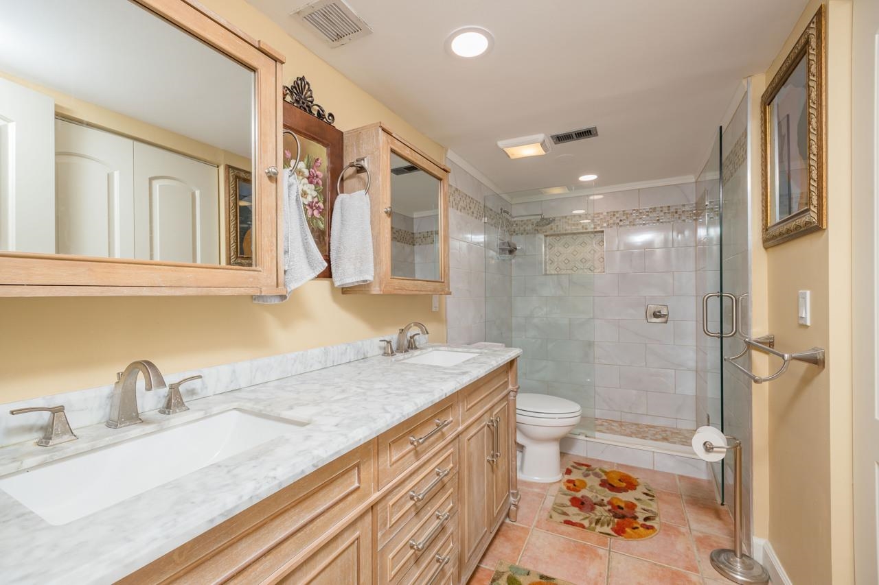 2 Dondanville Road, Unit 304 St. Augustine, FL 32080 - Photo 13 of 43 a bathroom with a granite countertop sink toilet and shower