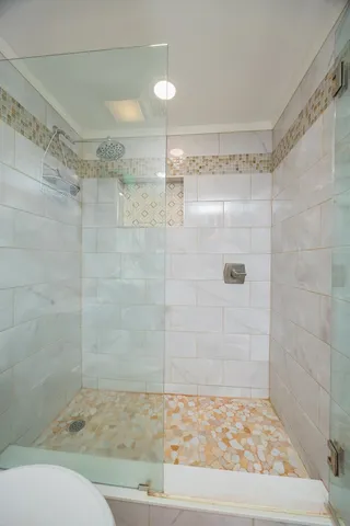 a bathroom with a toilet sink and a mirror