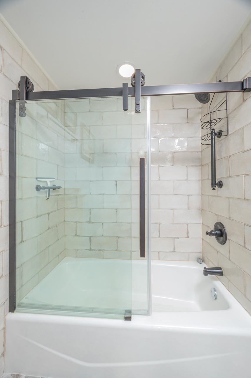 2 Dondanville Road, Unit 304 St. Augustine, FL 32080 - Photo 17 of 43 a bathroom with a shower and a bath tub