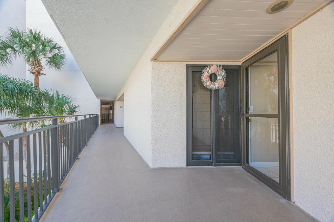 2 Dondanville Road, Unit 304 St. Augustine, FL 32080 - Photo 18 of 43 a view of a hallway with wooden floor and stairs