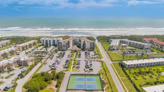 a front view of building with a garden