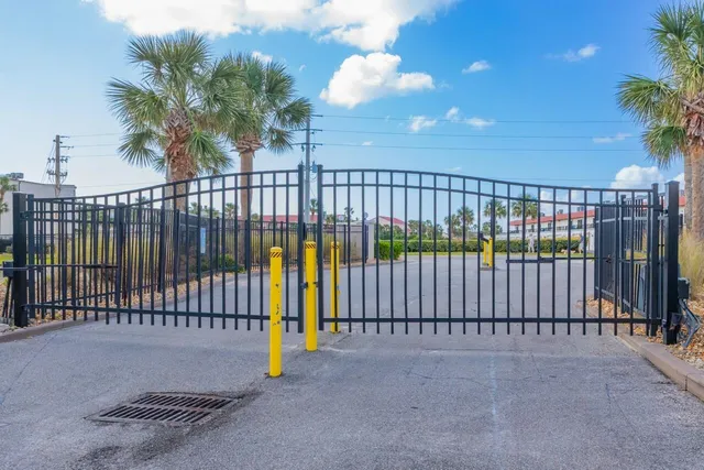 a view of balcony with wooden floor and fence