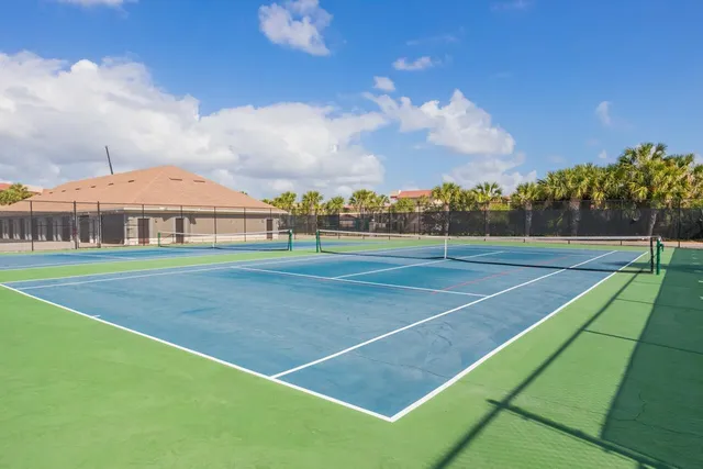a view of a balcony with wooden floor