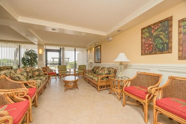 a view of a dining room with furniture and window