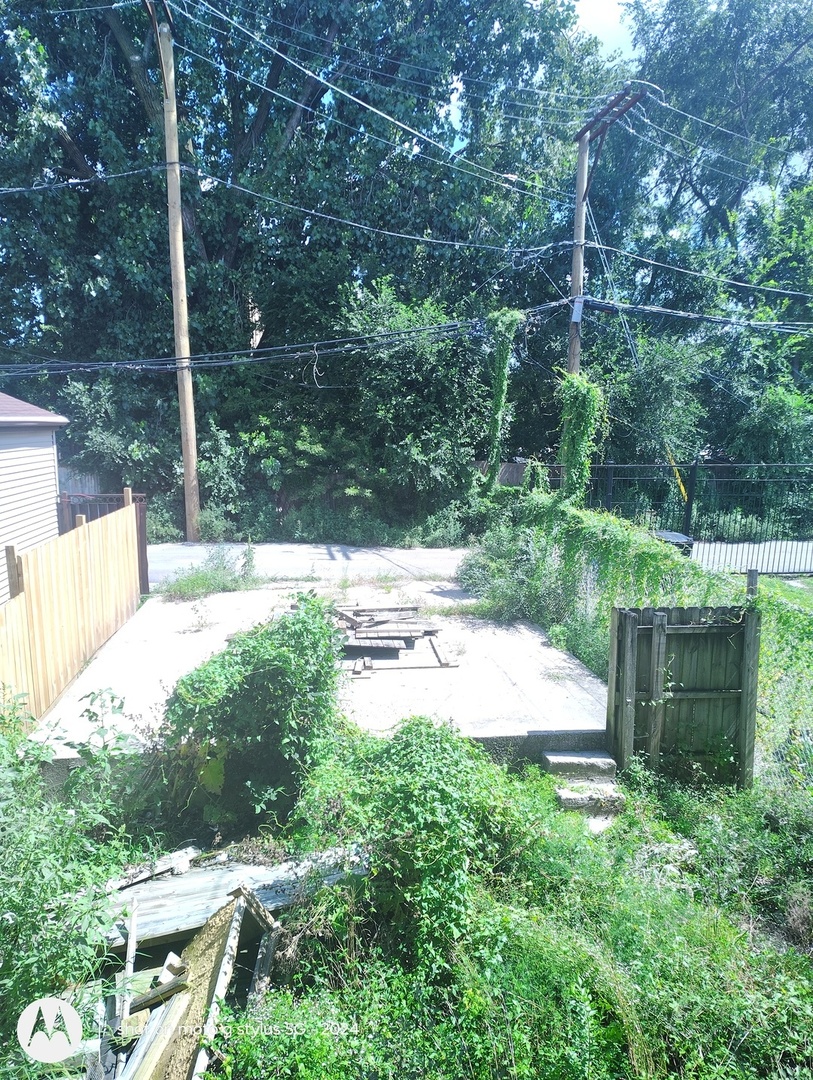 1661 South Homan Avenue, Unit 1 Chicago, IL 60623 - Photo 11 of 11 a view of backyard with outdoor seating and green space