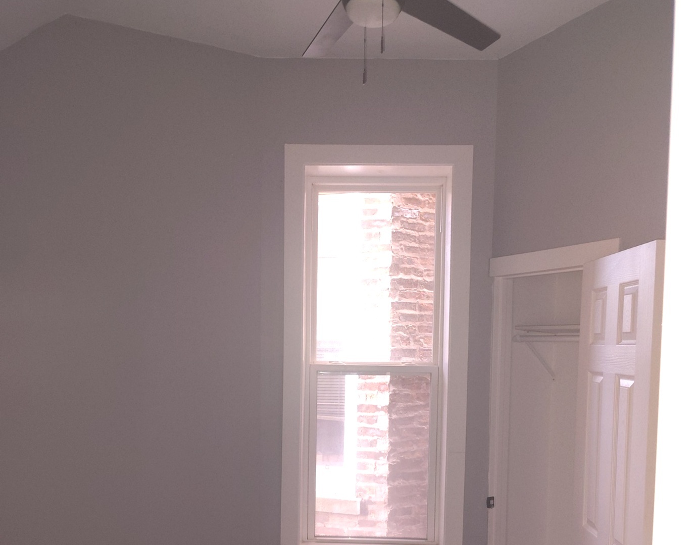 1661 South Homan Avenue, Unit 1 Chicago, IL 60623 - Photo 10 of 11 a view of an empty room with a window