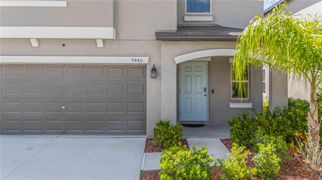 9440 Lemon Drop Loop Sun City Center, FL 33573 - Photo 6 of 55 a view of a entryway door of the house