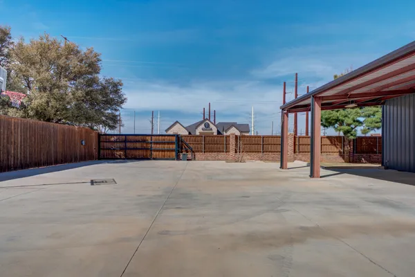 a view of backyard with seating space