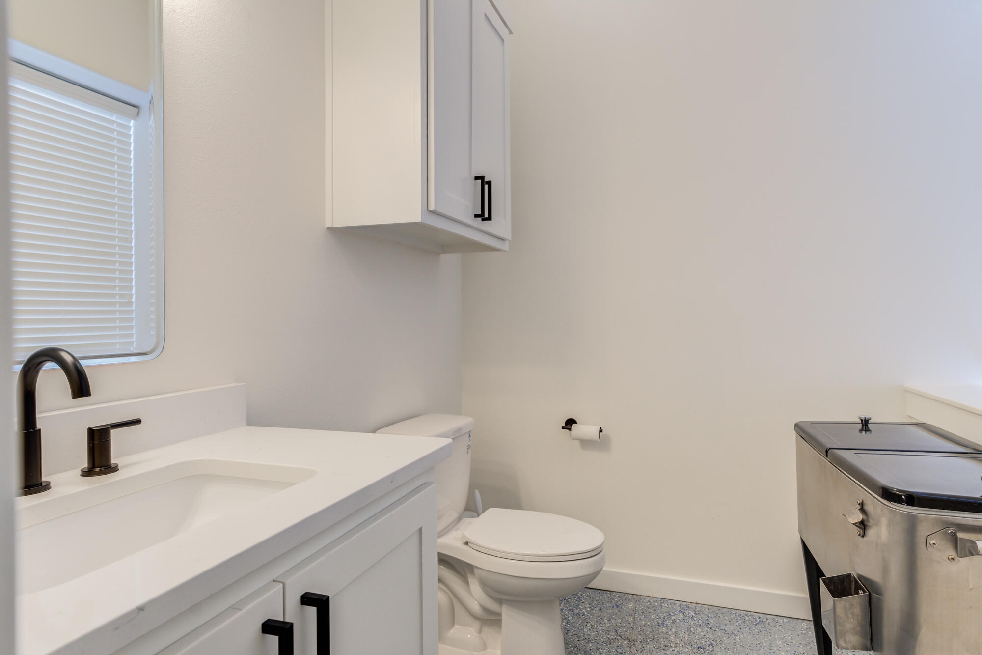 3405 107th Street Lubbock, TX 79423 - Photo 12 of 41 a bathroom with a sink and a toilet