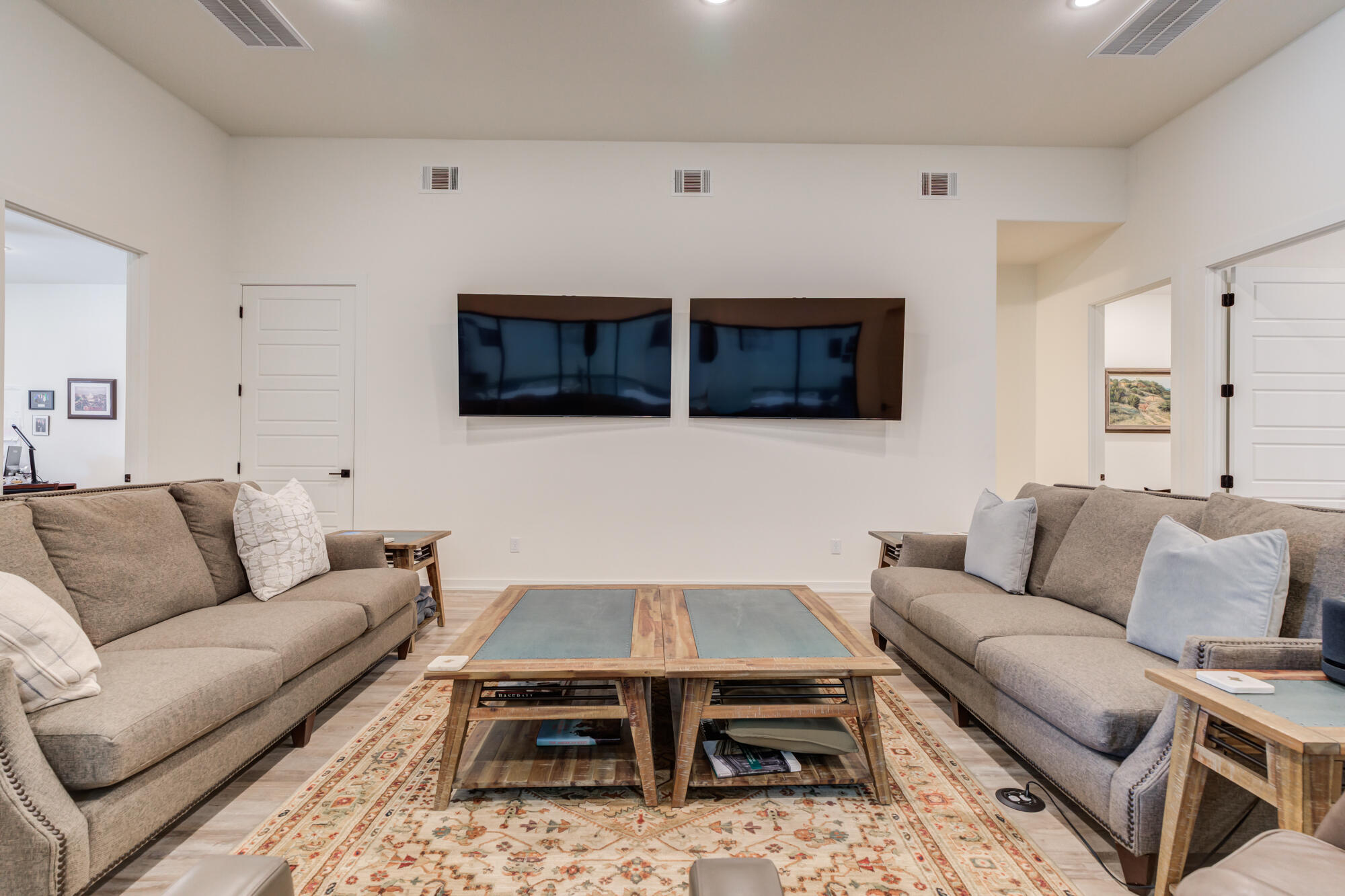 3405 107th Street Lubbock, TX 79423 - Photo 16 of 41 a living room with furniture a flat screen tv and kitchen view