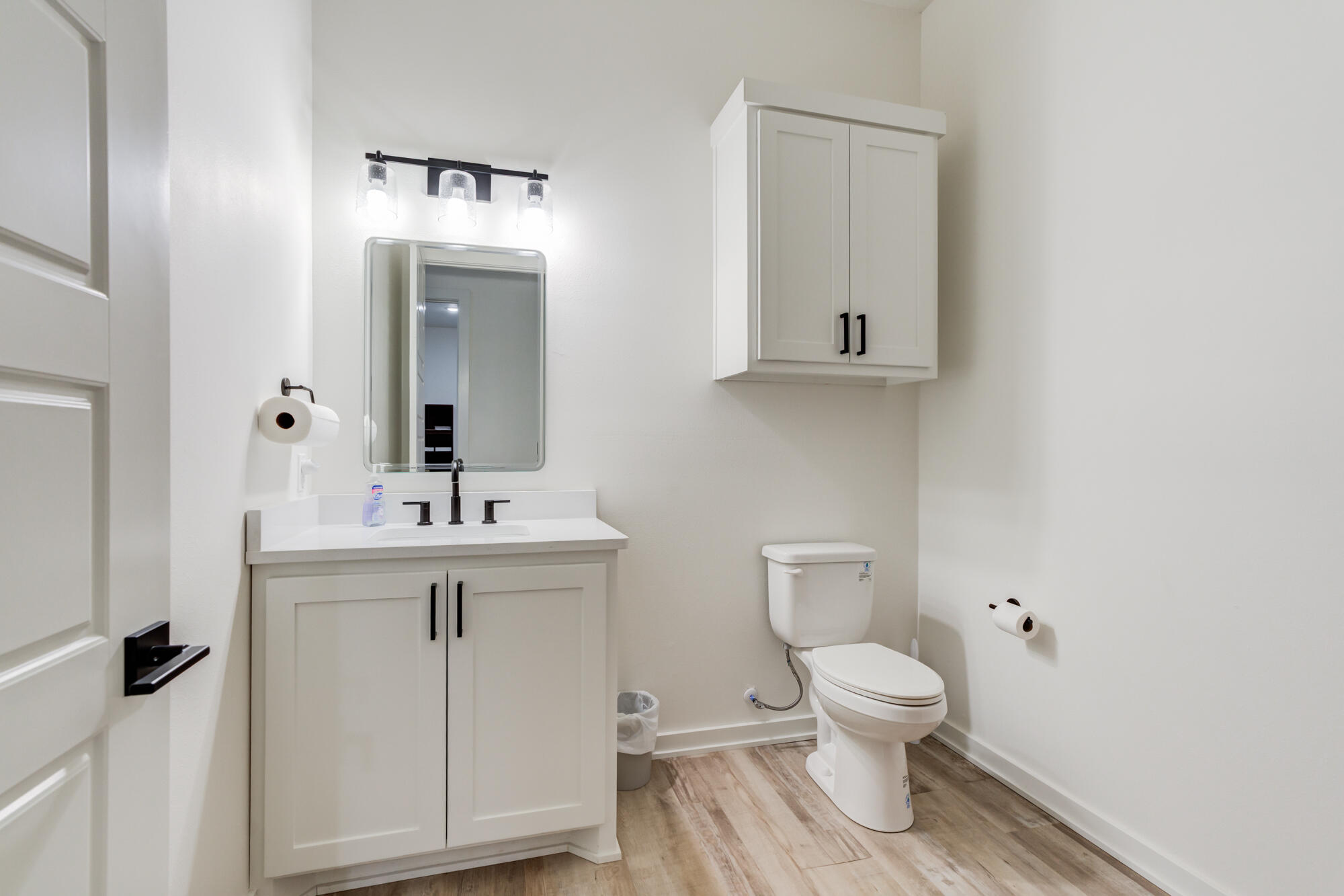 3405 107th Street Lubbock, TX 79423 - Photo 21 of 41 a bathroom with a toilet a sink and mirror