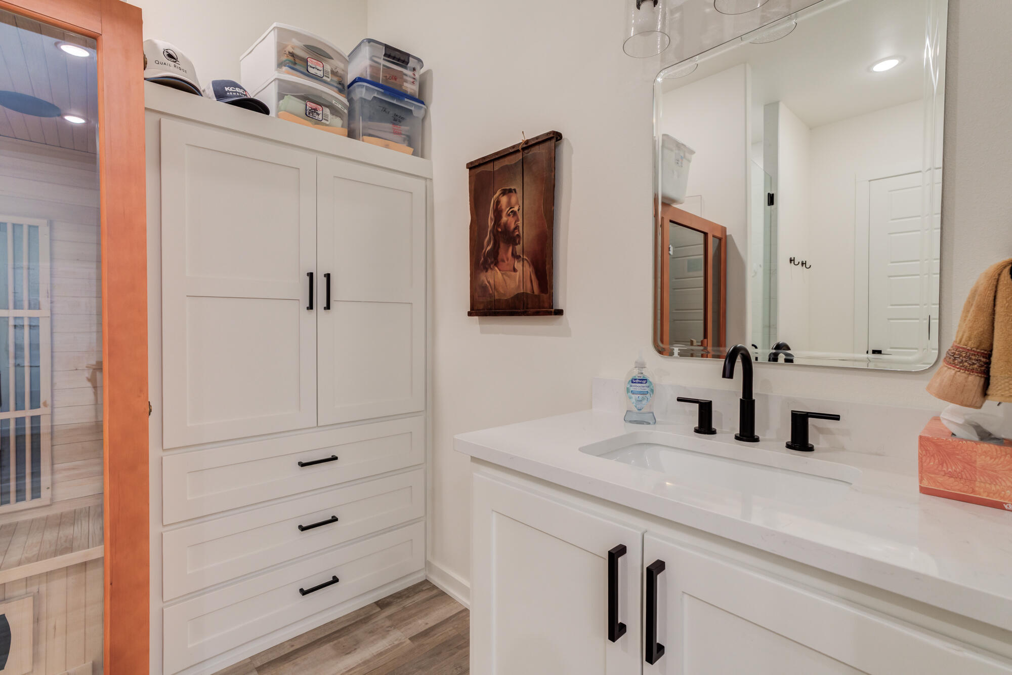 3405 107th Street Lubbock, TX 79423 - Photo 29 of 41 a bathroom with a sink and a mirror