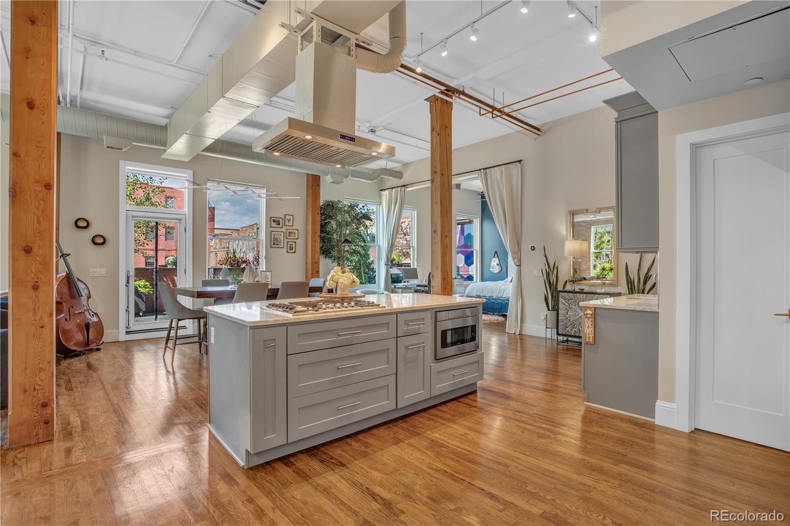 1501 Wazee Street, Unit 4B Denver, CO 80202 - Photo 11 of 40 a view of kitchen with sink and wooden floor
