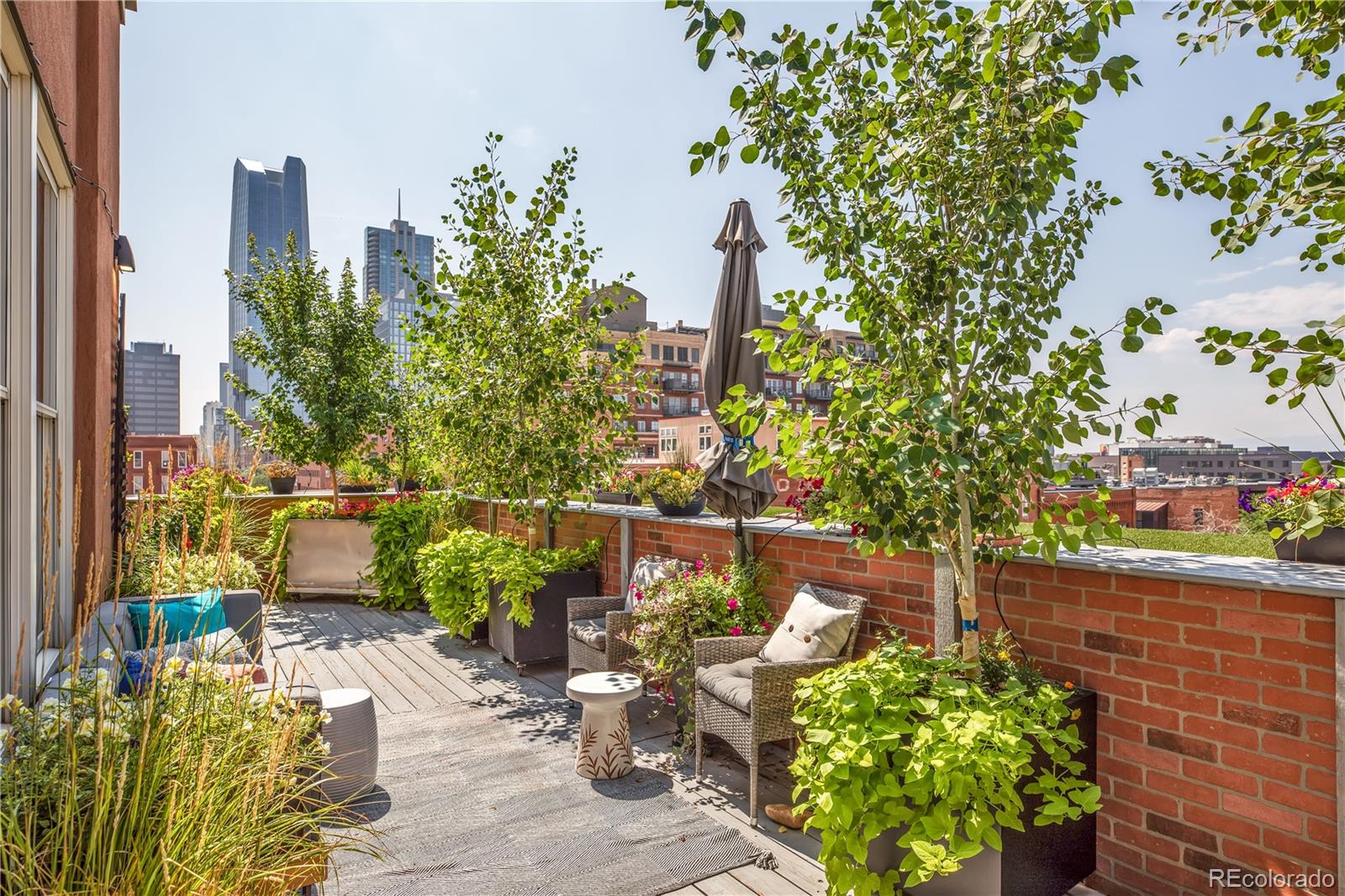1501 Wazee Street, Unit 4B Denver, CO 80202 - Photo 25 of 40 a balcony with outdoor seating and plants