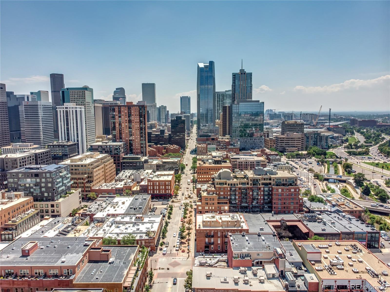 1501 Wazee Street, Unit 4B Denver, CO 80202 - Photo 37 of 40 a city view with tall buildings