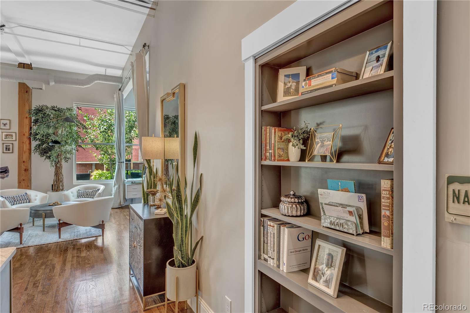 1501 Wazee Street, Unit 4B Denver, CO 80202 - Photo 5 of 40 a view of a kitchen with stainless steel appliances and chandelier