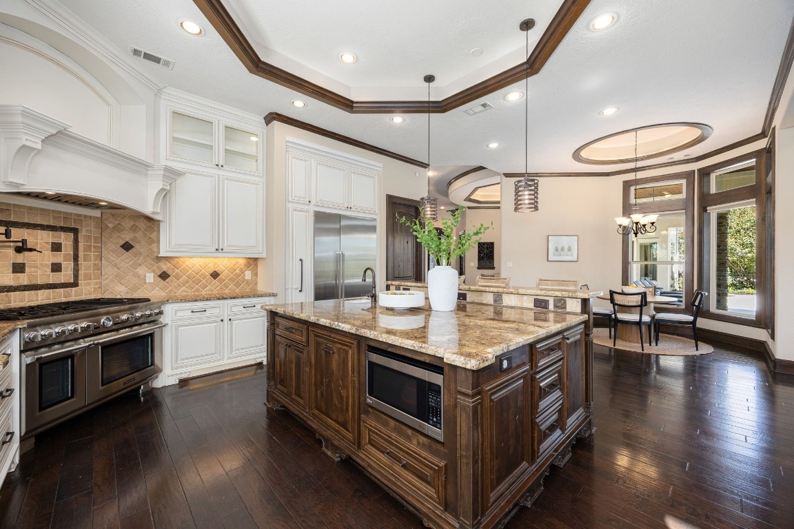 27302 Keystone Bend Court Spring, TX 77386 - Photo 11 of 50 Chefs dream kitchen with SS appliances, pot filler, huge island with bar seating and so many cabinets!