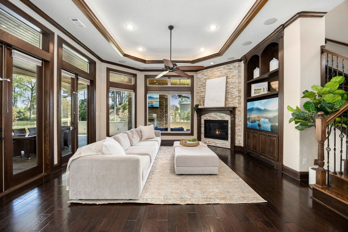 27302 Keystone Bend Court Spring, TX 77386 - Photo 6 of 50 Spacious family room with built ins, remote start gas fireplace, two sets of French doors and open to the kitchen.