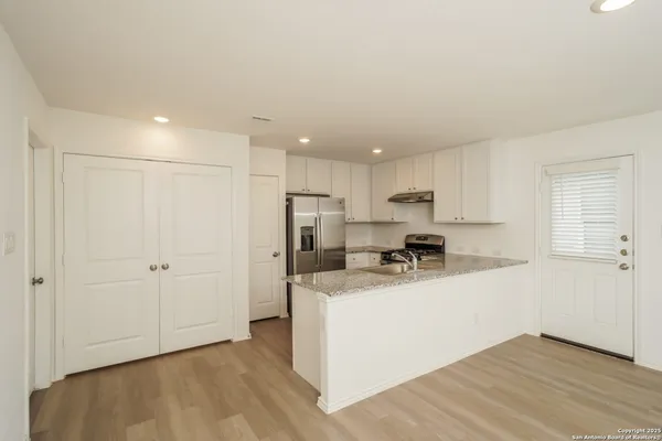 a view of a kitchen with a sink and dishwasher