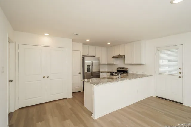 a view of a kitchen with a sink and dishwasher