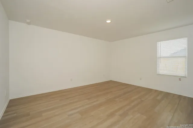 a bathroom with a granite countertop sink toilet a mirror and shower