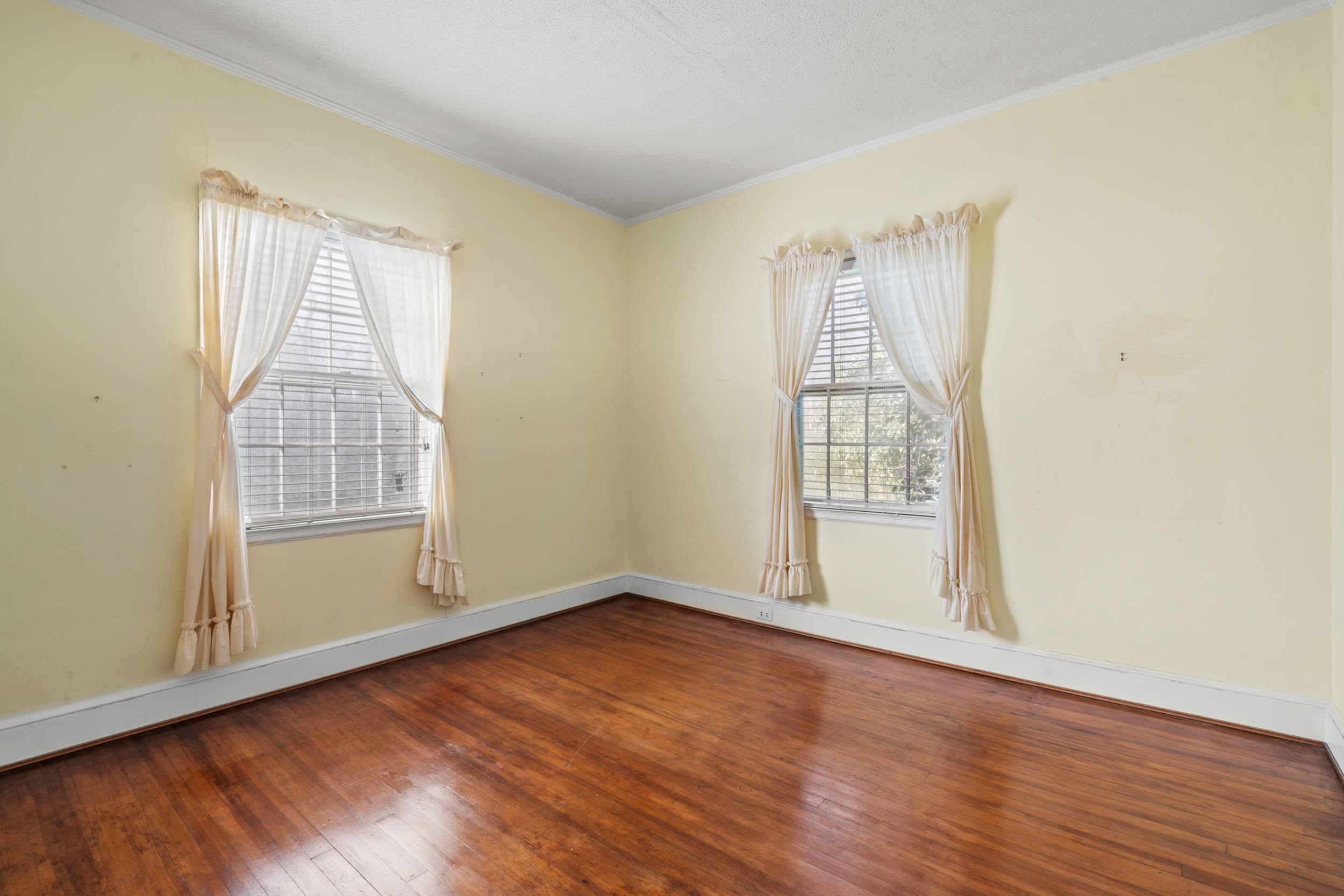 426 North Park Street Mullins, SC 29574 - Photo 14 of 39 Unfurnished room with hardwood / wood-style floors and crown molding