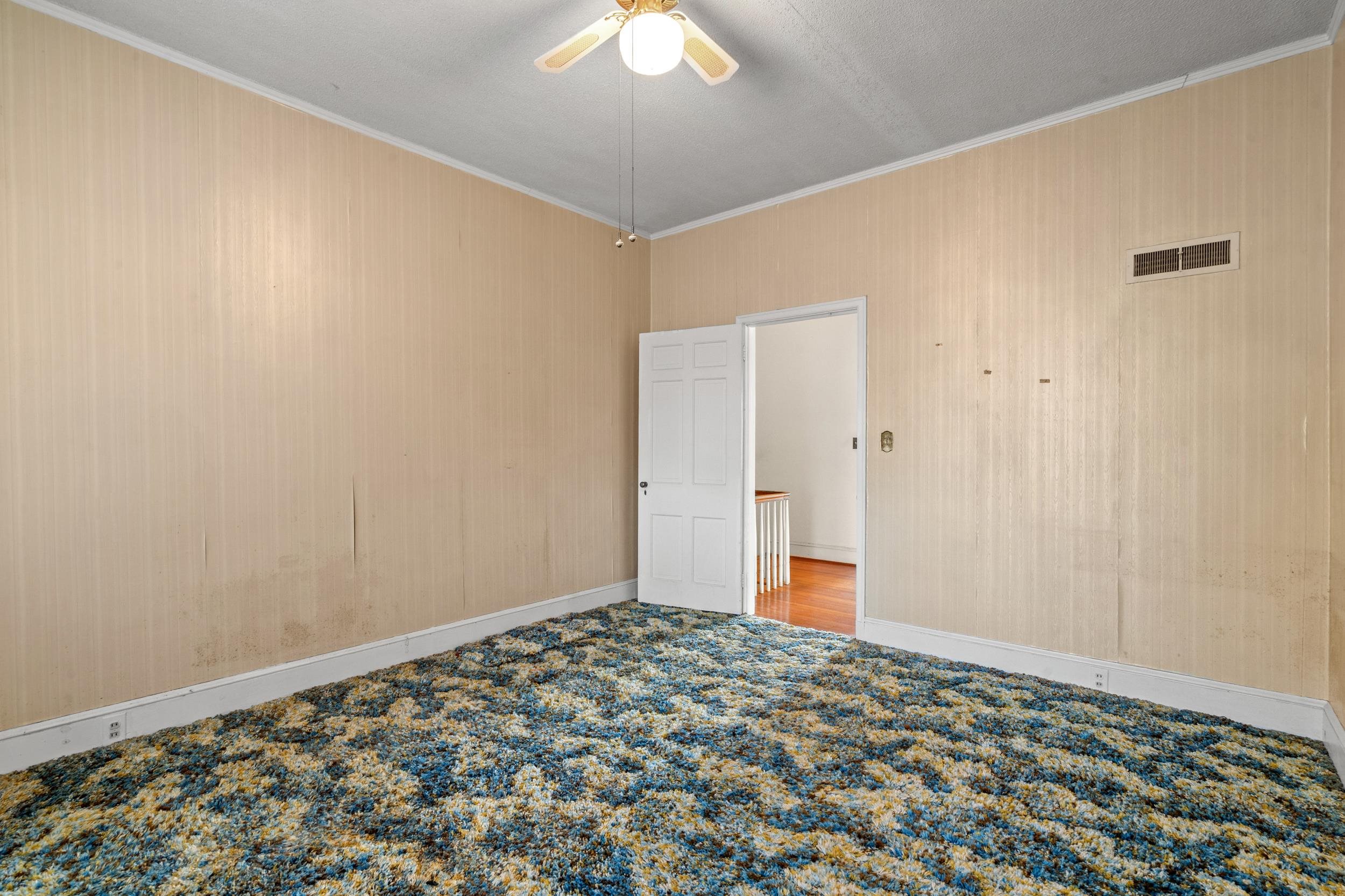 426 North Park Street Mullins, SC 29574 - Photo 24 of 39 Carpeted spare room featuring ornamental molding and ceiling fan